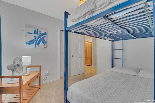 9427 Hacienda Acres, San Antonio, TX 78245 - bedroom with light colored carpet and a closet