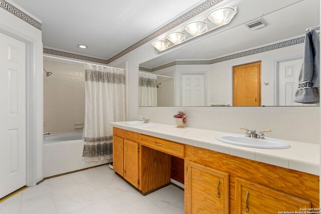 655 Shepherds, Bulverde, TX 78163 - full bath with marble finish flooring, tiled shower / bath, double vanity, recessed lighting, and crown molding