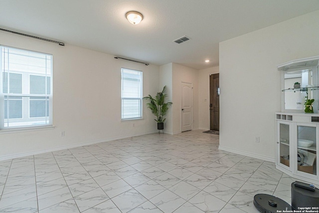 8298 Assumption Dr, San Antonio, TX 78254 - unfurnished room with light marble finish floors and recessed lighting