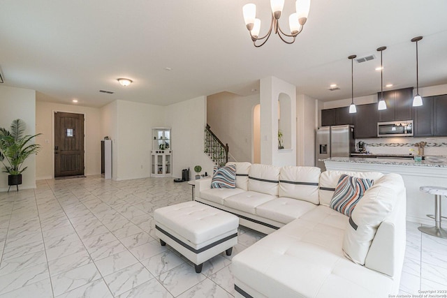 8298 Assumption Dr, San Antonio, TX 78254 - living room with light marble finish flooring, stairway, recessed lighting, and a chandelier