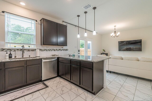8298 Assumption Dr, San Antonio, TX 78254 - kitchen with stainless steel dishwasher, light marble finish flooring, a chandelier, a peninsula, and recessed lighting