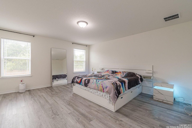8298 Assumption Dr, San Antonio, TX 78254 - bedroom with wood finished floors and baseboards