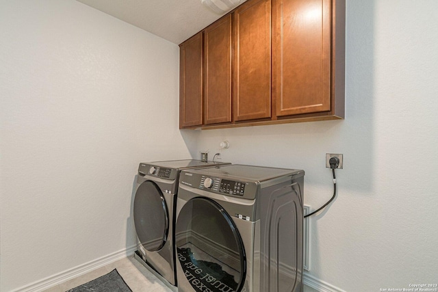 8298 Assumption Dr, San Antonio, TX 78254 - laundry room featuring cabinet space and washer and clothes dryer