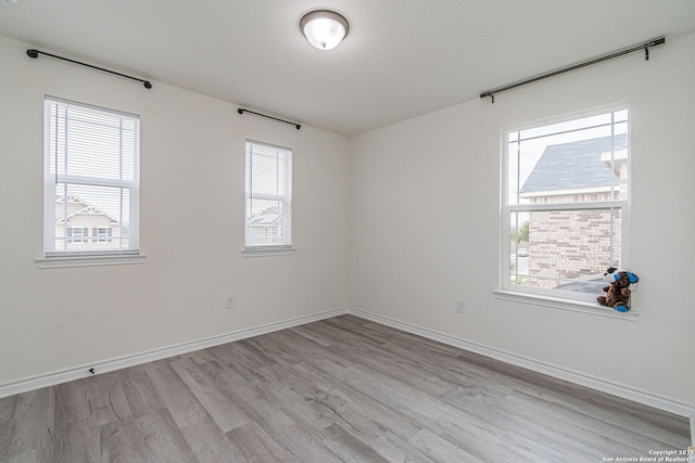 8298 Assumption Dr, San Antonio, TX 78254 - empty room with wood finished floors and baseboards