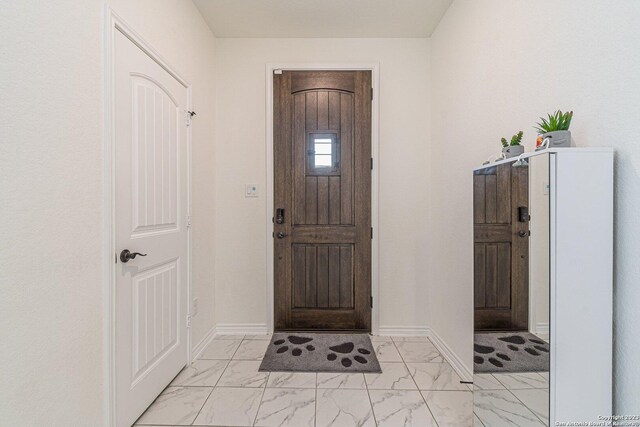 8298 Assumption Dr, San Antonio, TX 78254 - foyer with light marble finish flooring and baseboards