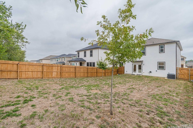 8298 Assumption Dr, San Antonio, TX 78254 - back of house featuring french doors and a fenced backyard