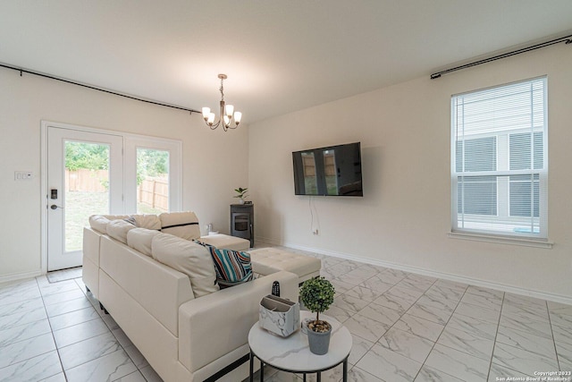 8298 Assumption Dr, San Antonio, TX 78254 - living area featuring light marble finish flooring and a chandelier