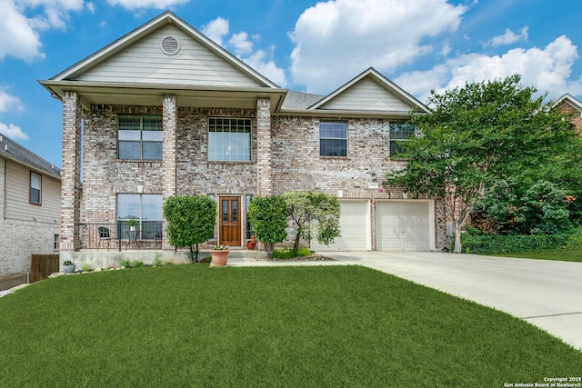 20927 Las Lomas Blvd, San Antonio, TX 78258 - view of front facade featuring brick siding, driveway, a front yard, and a garage