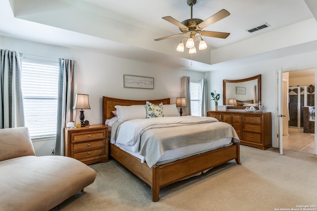20927 Las Lomas Blvd, San Antonio, TX 78258 - bedroom featuring light carpet, a ceiling fan, and connected bathroom