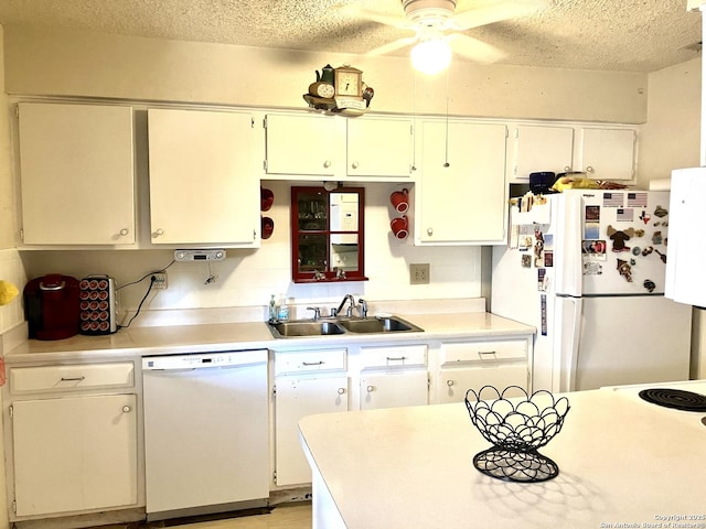 404 Alta, Pleasanton, TX 78064 - kitchen featuring white appliances, a textured ceiling, ceiling fan, light countertops, and white cabinetry
