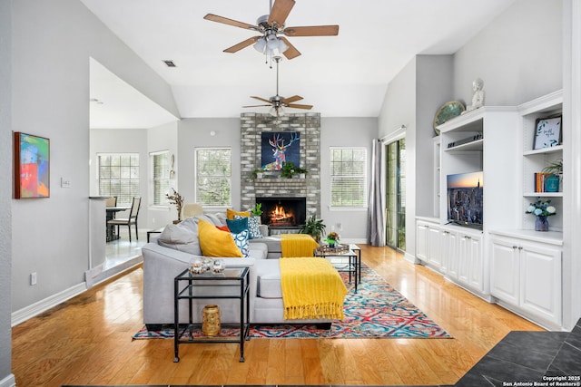 109 Trailcrest, Hollywood Park, TX 78232 - living room featuring healthy amount of natural light, ceiling fan, light wood finished floors, and high vaulted ceiling