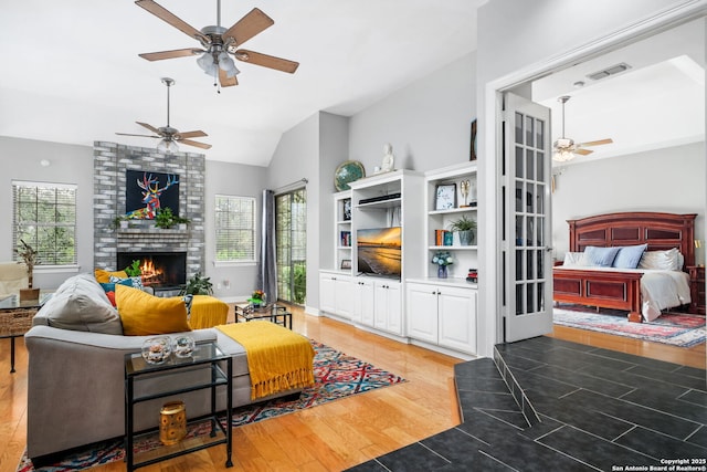 109 Trailcrest, Hollywood Park, TX 78232 - living area with a ceiling fan, plenty of natural light, a fireplace, and lofted ceiling