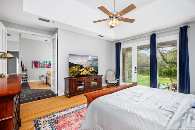 109 Trailcrest, Hollywood Park, TX 78232 - bedroom featuring wood finished floors, french doors, access to outside, and ceiling fan