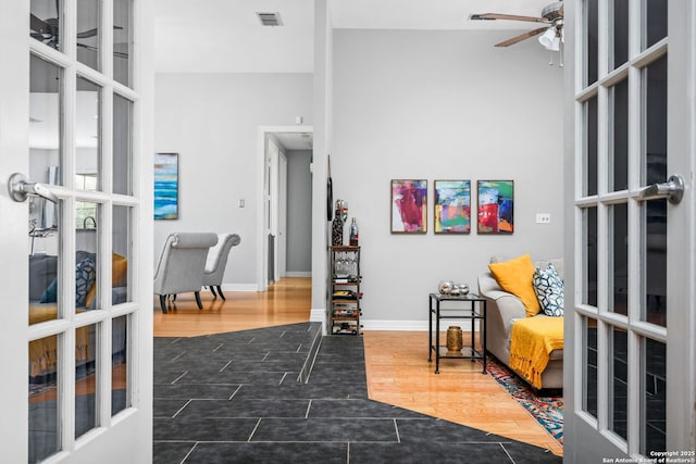 109 Trailcrest, Hollywood Park, TX 78232 - sitting room with a ceiling fan, french doors, and wood finished floors