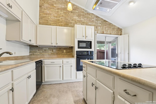 12010 Arms Way, Live Oak, TX 78233 - kitchen featuring black appliances, vaulted ceiling, light countertops, backsplash, and white cabinets