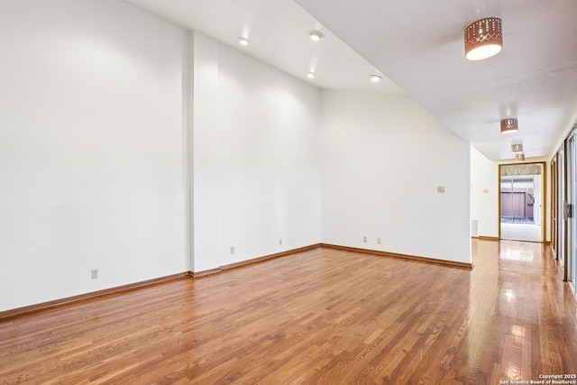 12010 Arms Way, Live Oak, TX 78233 - empty room featuring light wood-style floors and lofted ceiling
