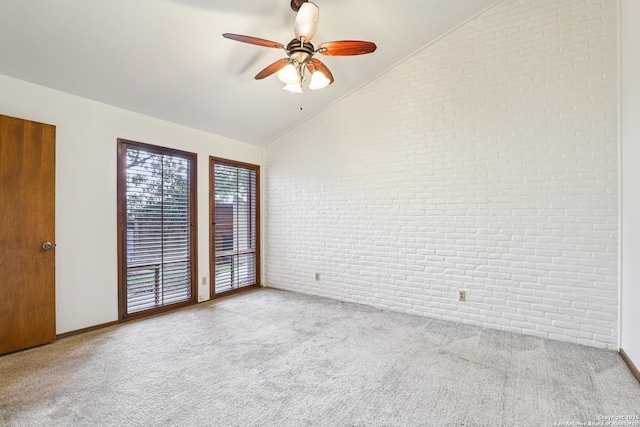12010 Arms Way, Live Oak, TX 78233 - empty room featuring brick wall, vaulted ceiling, carpet, and ceiling fan