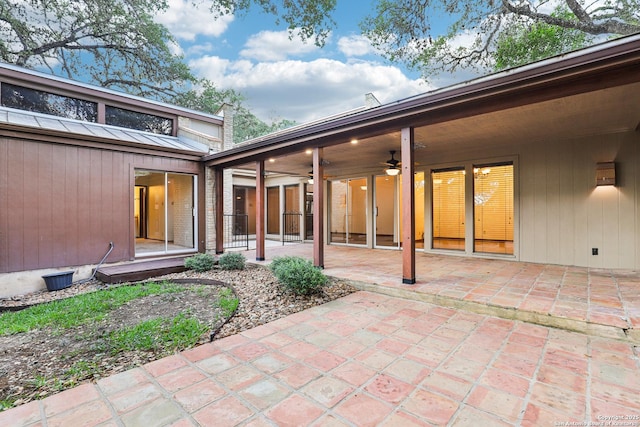 12010 Arms Way, Live Oak, TX 78233 - rear view of house featuring a ceiling fan, a patio area, a standing seam roof, and a metal roof