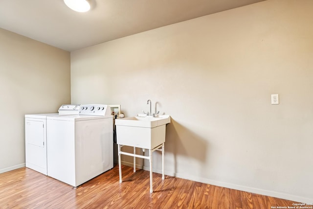 12010 Arms Way, Live Oak, TX 78233 - washroom featuring washer and dryer and light wood-style flooring
