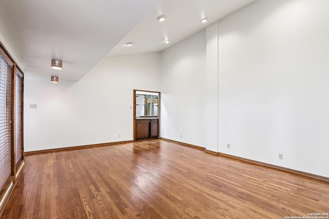 12010 Arms Way, Live Oak, TX 78233 - unfurnished room with lofted ceiling and wood finished floors