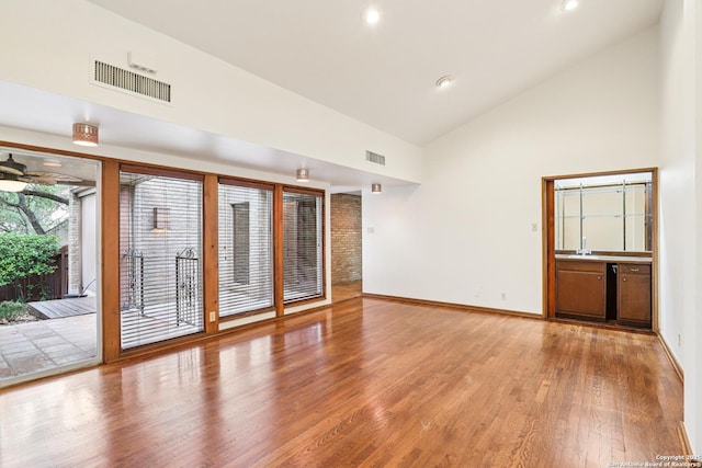 12010 Arms Way, Live Oak, TX 78233 - empty room with wood finished floors, high vaulted ceiling, recessed lighting, and ceiling fan