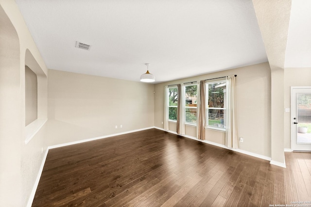 11406 Sawyer Vly, San Antonio, TX 78254 - spare room featuring dark wood-style flooring and arched walkways