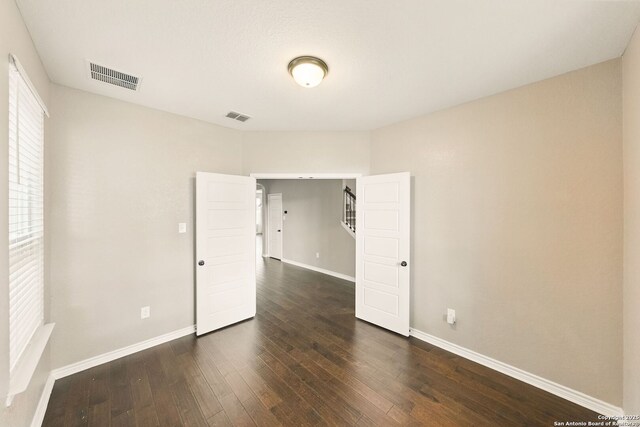 11406 Sawyer Vly, San Antonio, TX 78254 - spare room featuring dark wood-style floors and stairs