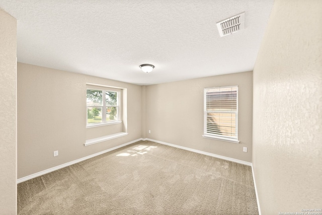 11406 Sawyer Vly, San Antonio, TX 78254 - carpeted spare room featuring baseboards and a textured ceiling
