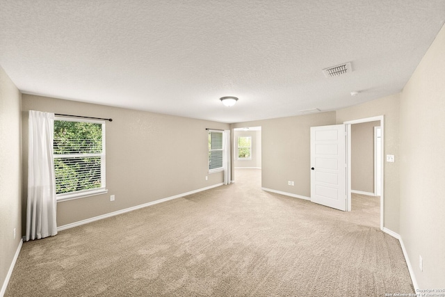 11406 Sawyer Vly, San Antonio, TX 78254 - empty room with carpet floors and a textured ceiling