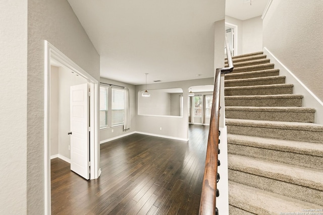 11406 Sawyer Vly, San Antonio, TX 78254 - stairs with hardwood / wood-style floors and a textured wall