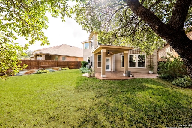 11406 Sawyer Vly, San Antonio, TX 78254 - back of property featuring a patio, a fenced backyard, and a ceiling fan