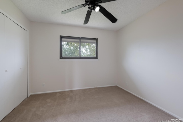 6403 Port Royal, San Antonio, TX 78244 - unfurnished bedroom with light carpet, a closet, a textured ceiling, and ceiling fan