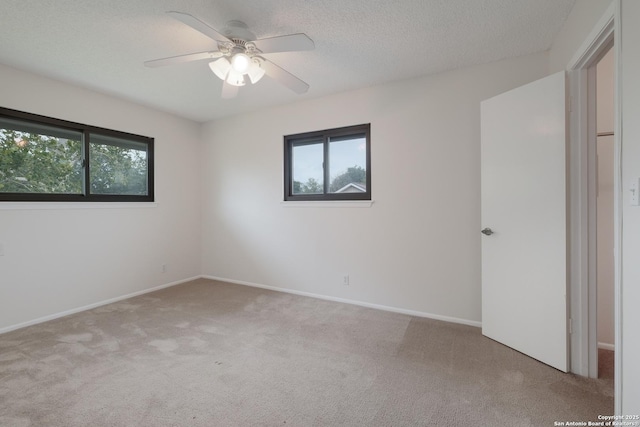 6403 Port Royal, San Antonio, TX 78244 - unfurnished bedroom featuring carpet floors, a ceiling fan, and a textured ceiling