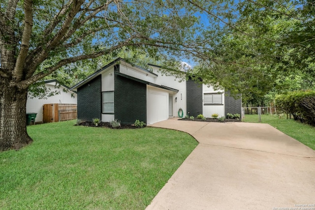 4204 Golden Spice Dr, San Antonio, TX 78222 - mid-century inspired home with brick siding, concrete driveway, and an attached garage