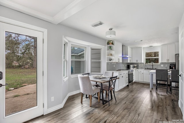 931 Republic Rd, New Caney, TX 77357 - dining room with plenty of natural light and dark wood-type flooring