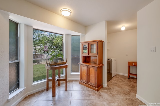 2516 Hidden Grv, Schertz, TX 78154 - doorway to outside featuring independent washer and dryer and light tile patterned floors