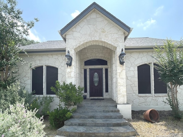 614 Slumber, San Antonio, TX 78260 - view of exterior entry with stone siding and a shingled roof