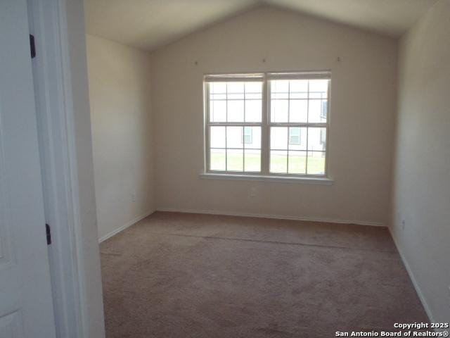 2201 Wirtz, Seguin, TX 78155 - carpeted empty room with lofted ceiling and baseboards