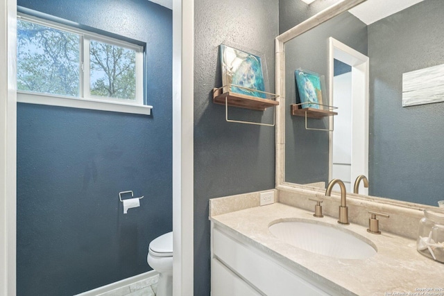 11214 Whisper Fls, San Antonio, TX 78230 - bathroom featuring vanity and a textured wall
