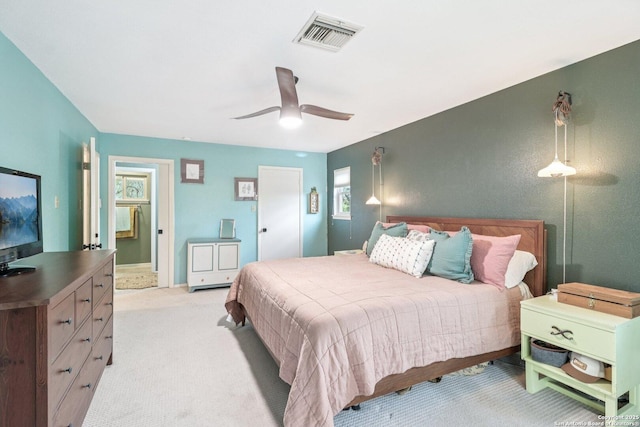 11214 Whisper Fls, San Antonio, TX 78230 - bedroom featuring light carpet, ceiling fan, and ensuite bathroom