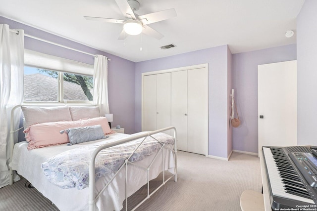 11214 Whisper Fls, San Antonio, TX 78230 - bedroom with light carpet, a closet, and a ceiling fan