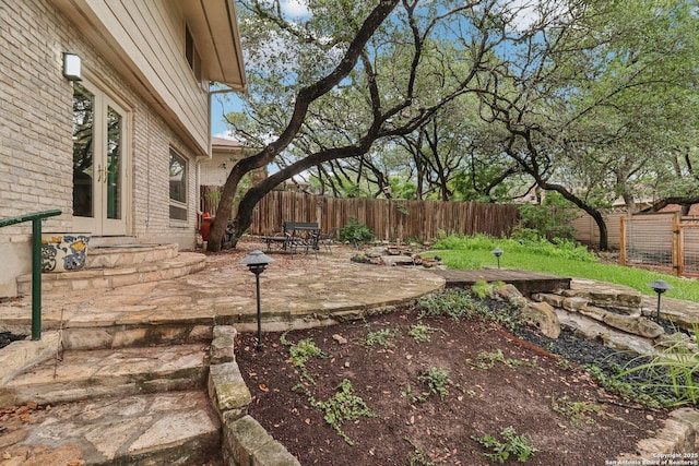 11214 Whisper Fls, San Antonio, TX 78230 - fenced backyard featuring french doors and a patio area