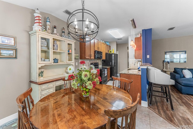 5330 Stormy Hls, San Antonio, TX 78247 - dining room featuring a chandelier and baseboards