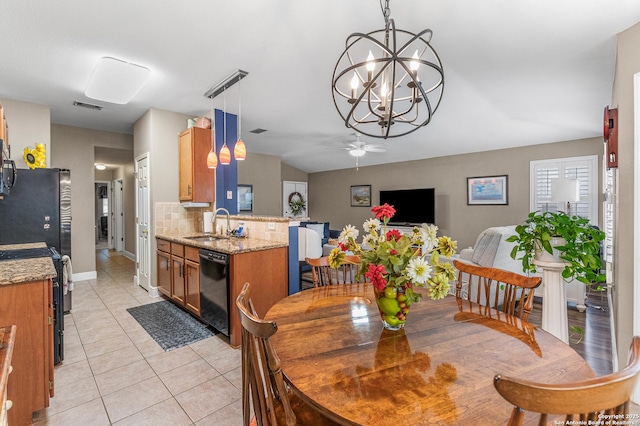 5330 Stormy Hls, San Antonio, TX 78247 - dining space with ceiling fan, light tile patterned flooring, a chandelier, and vaulted ceiling