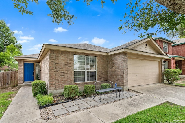 5330 Stormy Hls, San Antonio, TX 78247 - view of front of property with a garage, brick siding, and concrete driveway