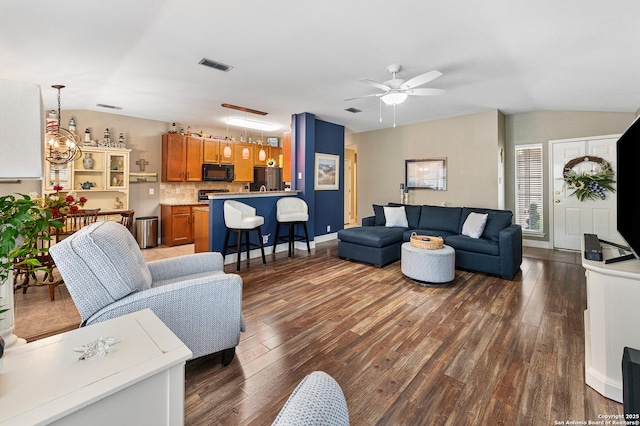 5330 Stormy Hls, San Antonio, TX 78247 - living room featuring vaulted ceiling, dark wood-type flooring, and a ceiling fan