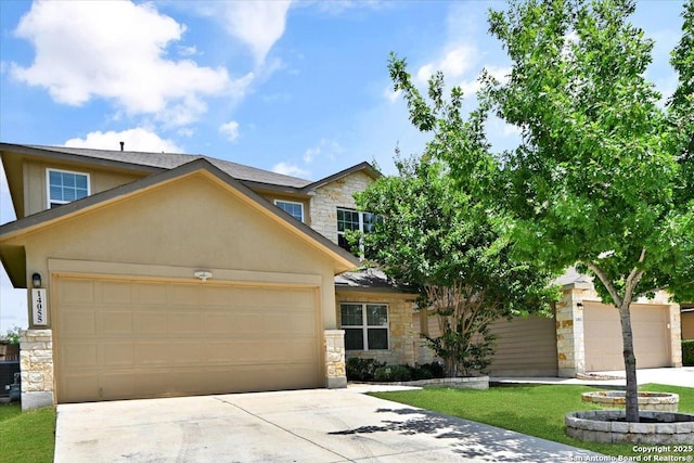 14055 Cremello Fls, San Antonio, TX 78254 - view of front facade featuring stone siding, an attached garage, driveway, and stucco siding