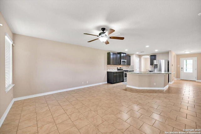 14055 Cremello Fls, San Antonio, TX 78254 - kitchen with appliances with stainless steel finishes, open floor plan, a ceiling fan, light countertops, and recessed lighting