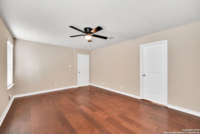 14055 Cremello Fls, San Antonio, TX 78254 - empty room featuring dark wood-style flooring, ceiling fan, and plenty of natural light