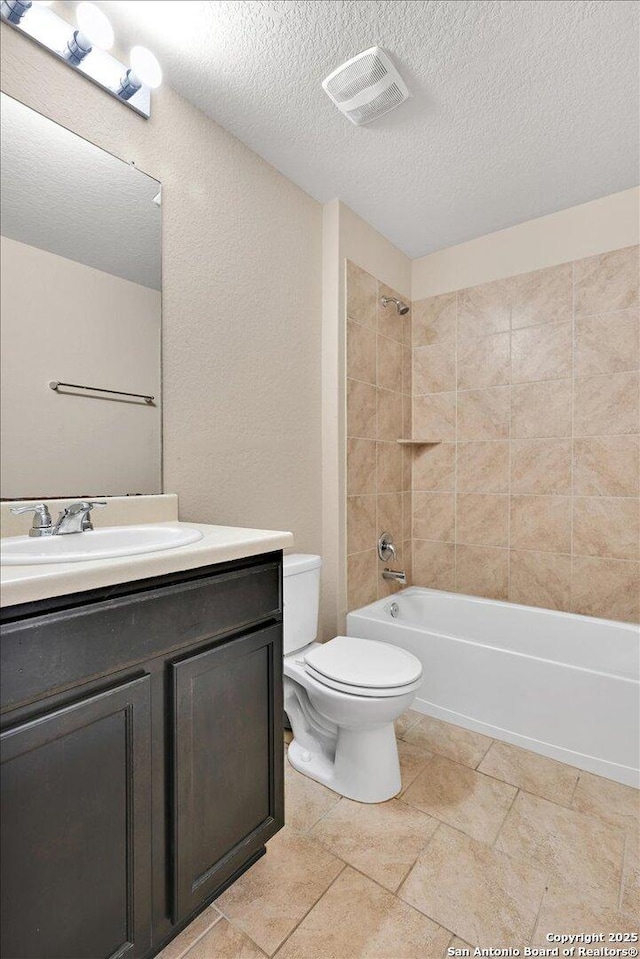 14055 Cremello Fls, San Antonio, TX 78254 - bathroom featuring vanity, a textured ceiling, and shower / bathtub combination